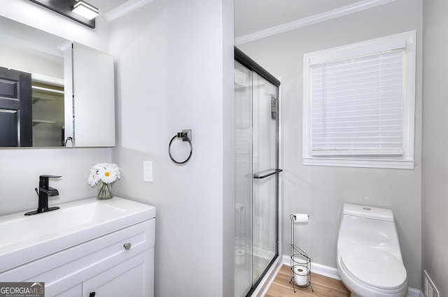 bathroom featuring wood finished floors, ornamental molding, and a shower stall