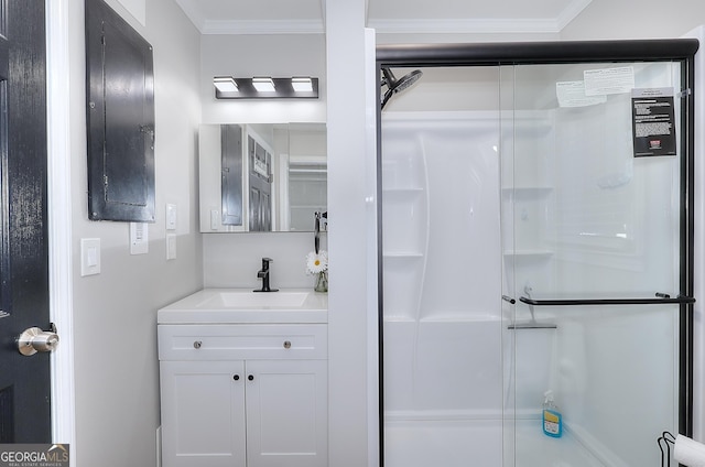 full bath featuring vanity, a shower stall, and ornamental molding