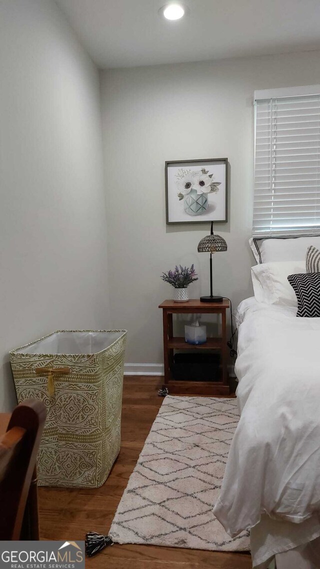 bedroom featuring wood finished floors