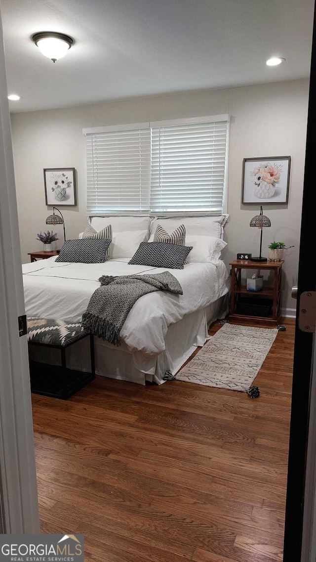 bedroom with wood finished floors