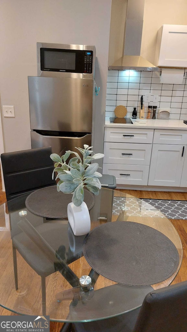 dining space featuring light wood-style floors