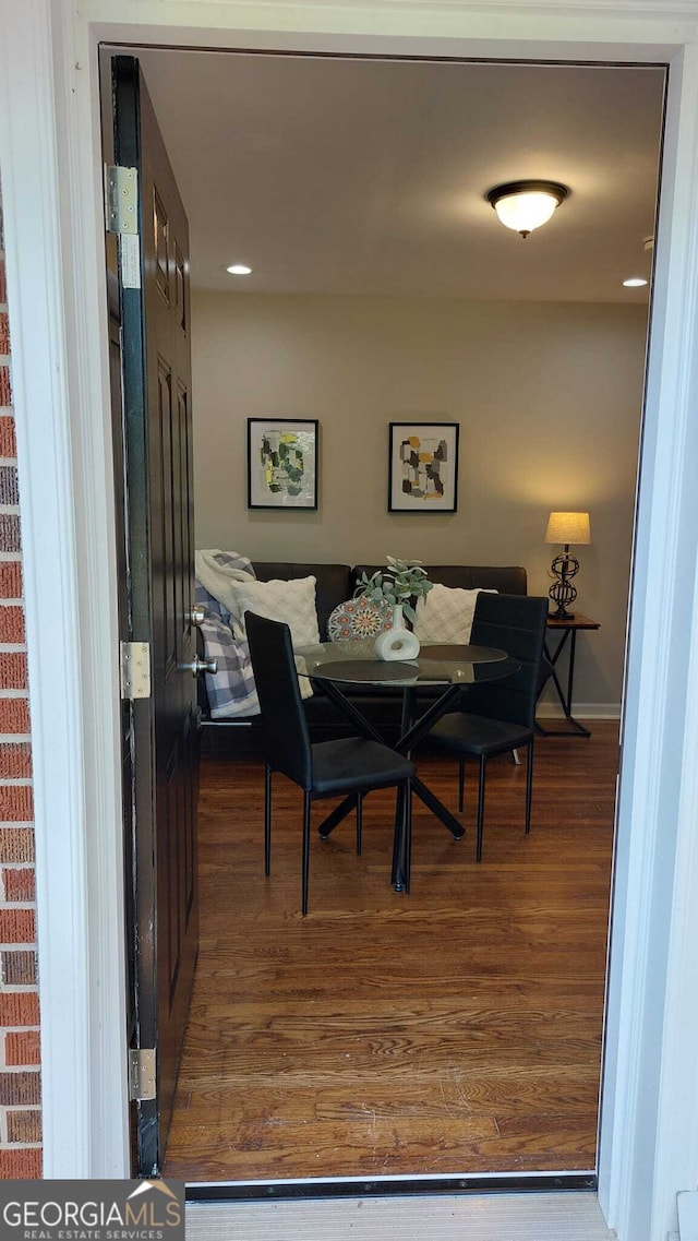 dining area with wood finished floors