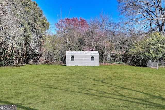 view of yard with a storage shed and an outdoor structure