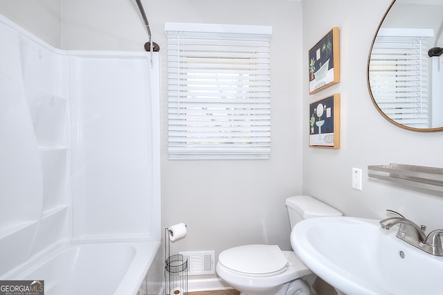 full bath with a sink, visible vents, toilet, and shower / bath combination