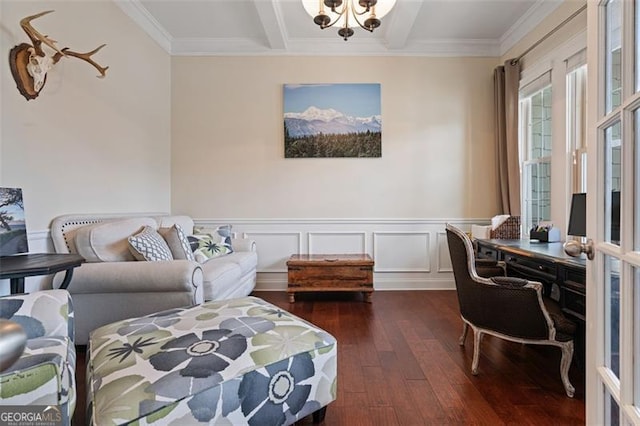 living area with beamed ceiling, a wainscoted wall, ornamental molding, hardwood / wood-style flooring, and an inviting chandelier