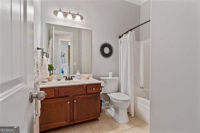 full bathroom with tile patterned flooring, shower / bath combo with shower curtain, toilet, and vanity