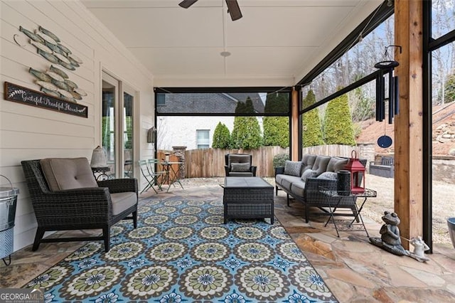 view of patio featuring a ceiling fan, fence, french doors, and an outdoor hangout area