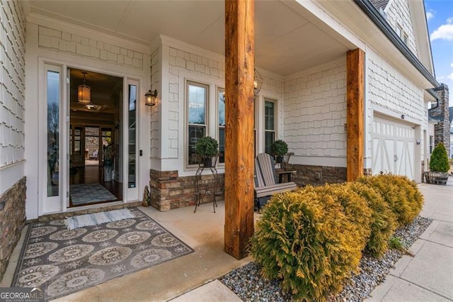 property entrance with a garage and a porch