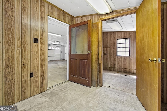 empty room featuring wood walls