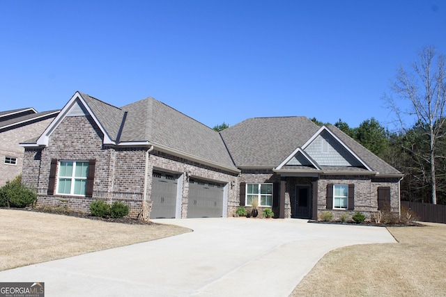 craftsman inspired home featuring brick siding, a shingled roof, fence, driveway, and an attached garage