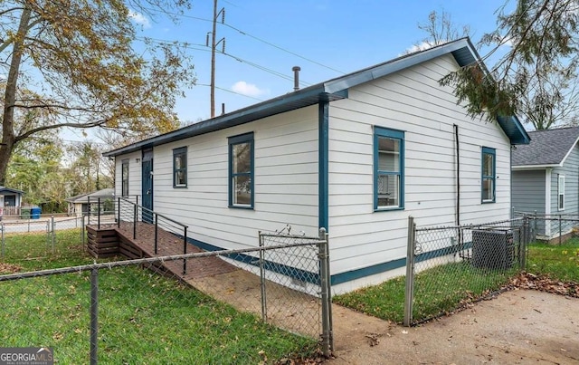 view of side of property featuring a yard and fence private yard