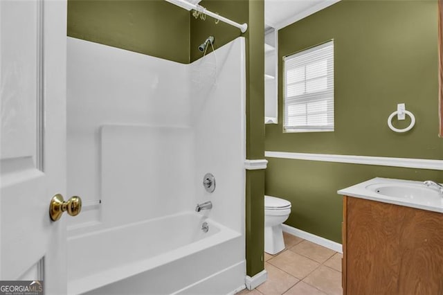 full bath featuring vanity, washtub / shower combination, baseboards, tile patterned flooring, and toilet