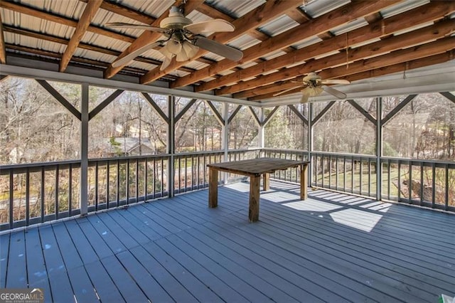 wooden terrace with glass enclosure and a ceiling fan