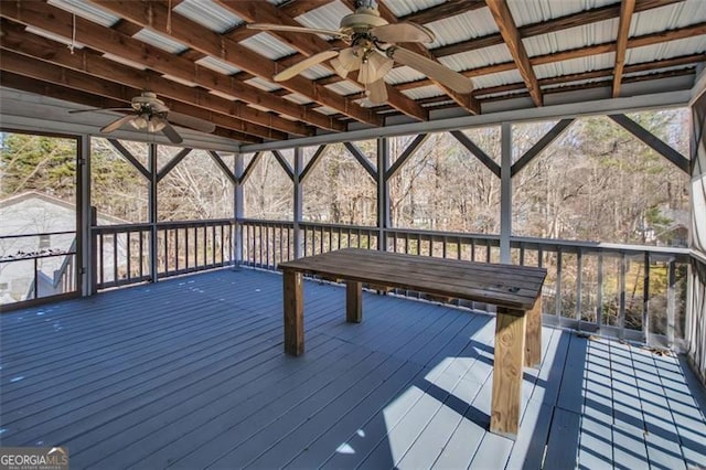 wooden terrace with a ceiling fan