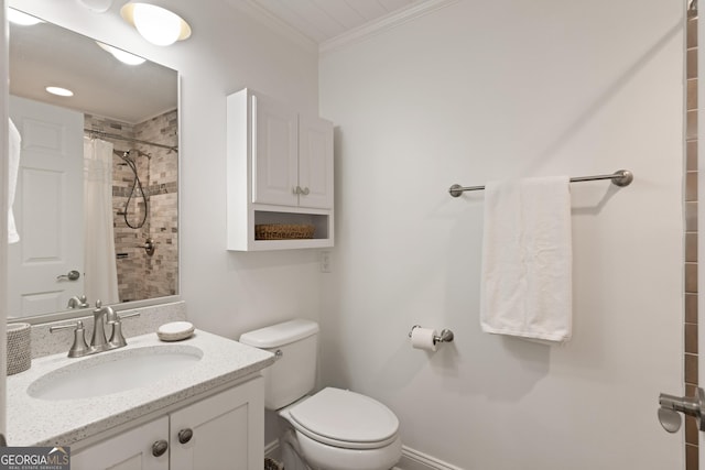 full bath with toilet, tiled shower, crown molding, baseboards, and vanity