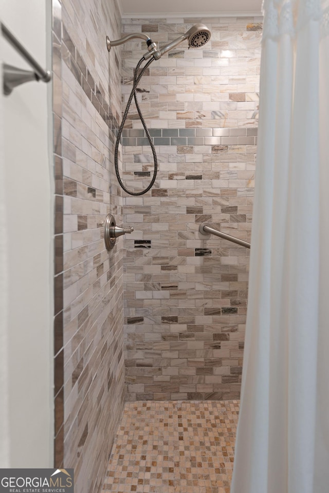 full bath with a tile shower