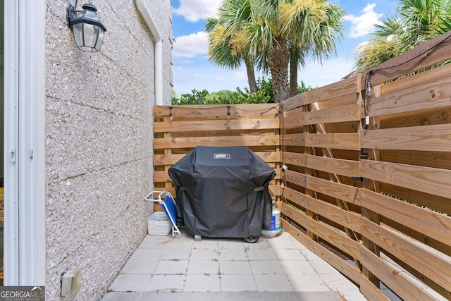 view of patio / terrace with fence and grilling area