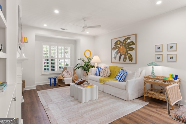 living area featuring visible vents, baseboards, ceiling fan, recessed lighting, and dark wood-style floors