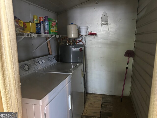 laundry area featuring washing machine and clothes dryer, laundry area, and water heater