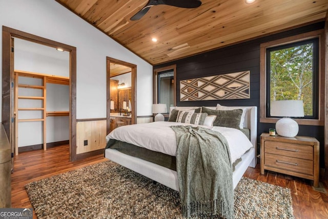 bedroom with a wainscoted wall, wood finished floors, recessed lighting, wooden ceiling, and lofted ceiling