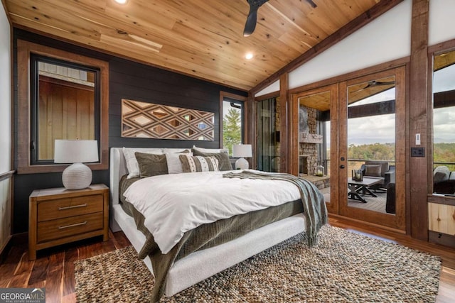 bedroom with dark wood finished floors, lofted ceiling, access to outside, and wood ceiling