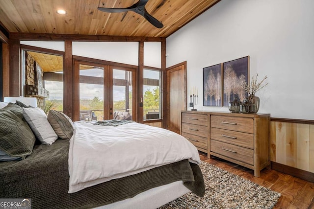 bedroom with dark wood finished floors, wood ceiling, lofted ceiling, recessed lighting, and french doors