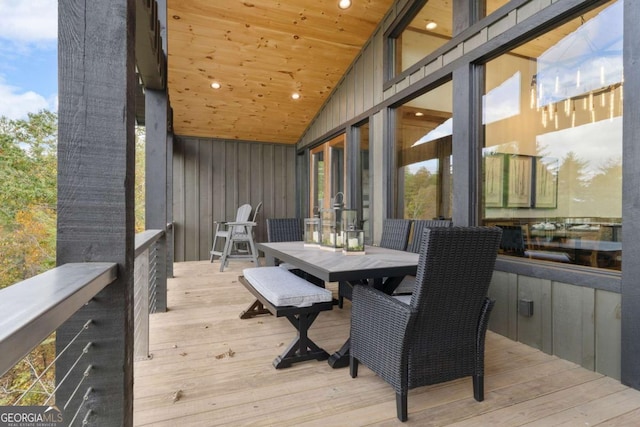 wooden terrace featuring outdoor dining area