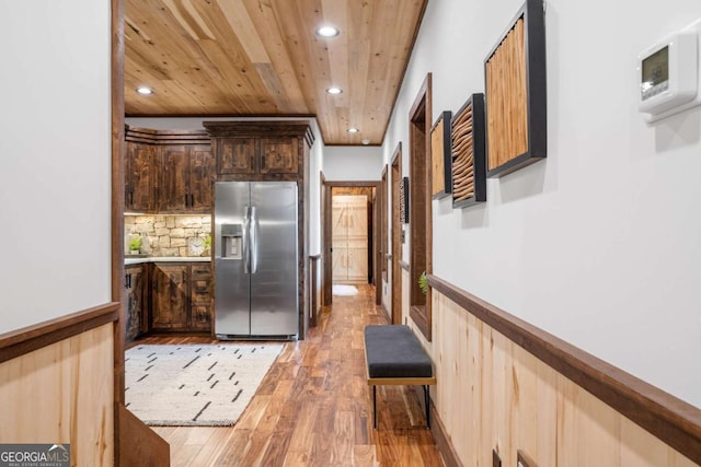 kitchen with backsplash, recessed lighting, wooden ceiling, light wood-style floors, and stainless steel refrigerator with ice dispenser