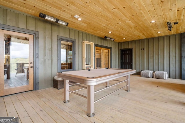 recreation room with wooden walls, recessed lighting, wooden ceiling, and wood-type flooring