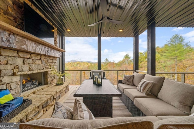 exterior space with an outdoor living space with a fireplace