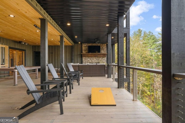 wooden deck with outdoor lounge area