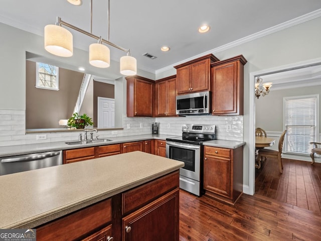 9035 Forest Path Dr, Gainesville, GA 30506 - kitchen with stainless steel appliances, ornamental molding, decorative light fixtures, tasteful backsplash, and a chandelier