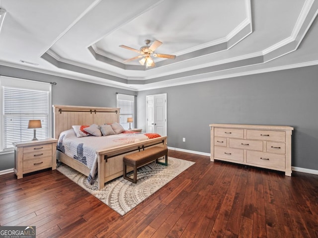 9035 Forest Path Dr, Gainesville, GA 30506 - bedroom featuring a tray ceiling, dark wood-style floors, ornamental molding, and ceiling fan