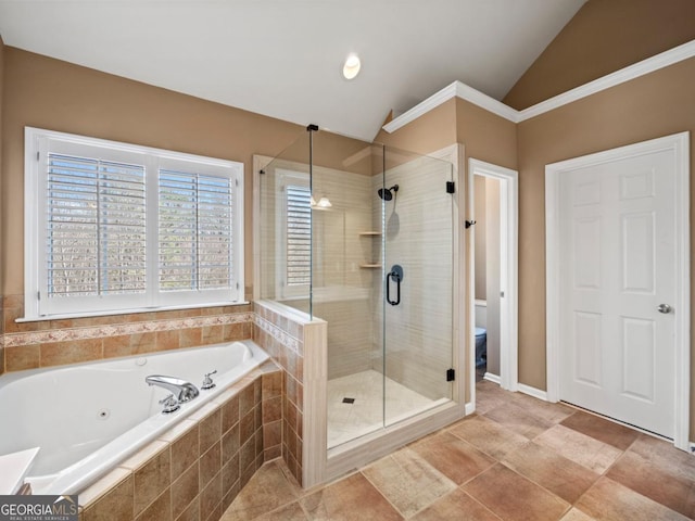 full bath with toilet, a stall shower, a jetted tub, and lofted ceiling