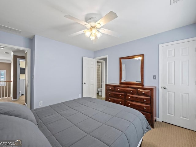 bedroom with carpet, a ceiling fan, and visible vents