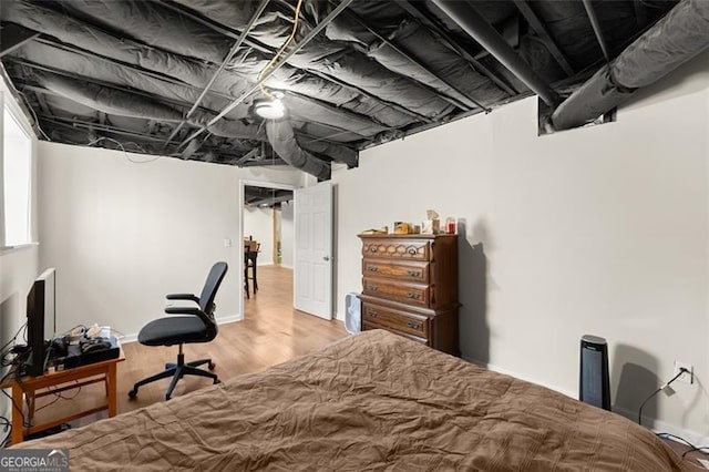 bedroom featuring wood finished floors