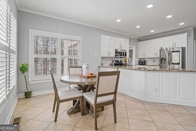 dining room featuring visible vents, baseboards, ornamental molding, light tile patterned floors, and recessed lighting