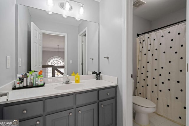 full bathroom featuring vanity, a shower with curtain, visible vents, tile patterned floors, and toilet