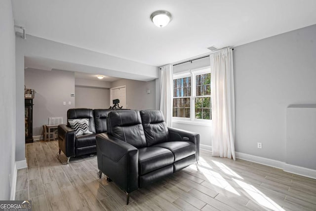 interior space with baseboards and wood finish floors