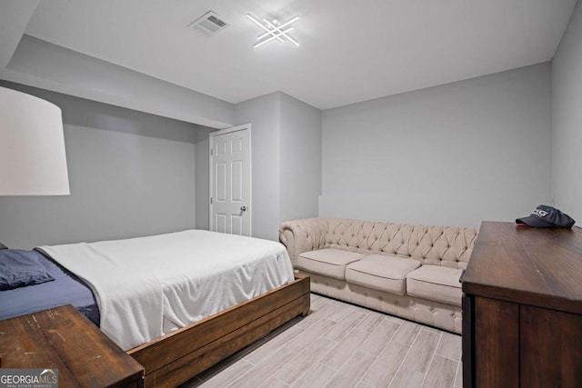 bedroom with visible vents and wood tiled floor