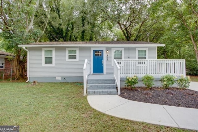 view of front of home featuring crawl space, covered porch, and a front yard