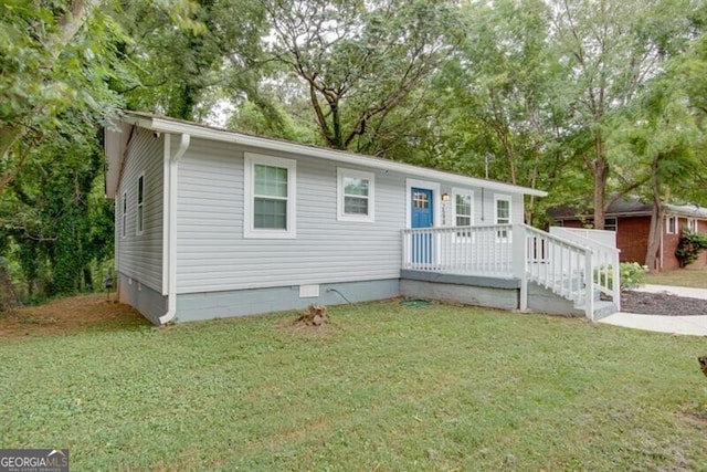 view of front of property with crawl space and a front yard