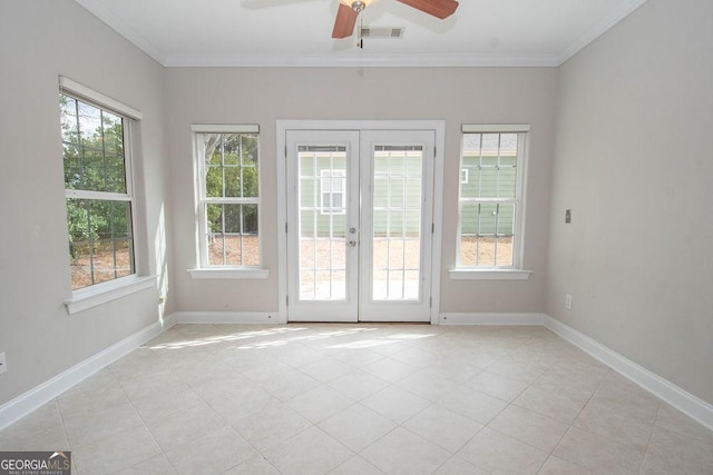 unfurnished room featuring crown molding, french doors, visible vents, and baseboards