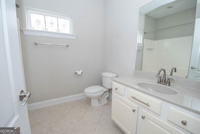 full bathroom with vanity, baseboards, tile patterned flooring, a shower, and toilet