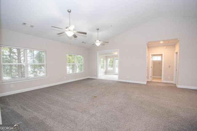 unfurnished living room with high vaulted ceiling, carpet, visible vents, and baseboards