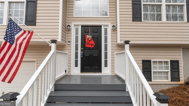 doorway to property featuring a garage