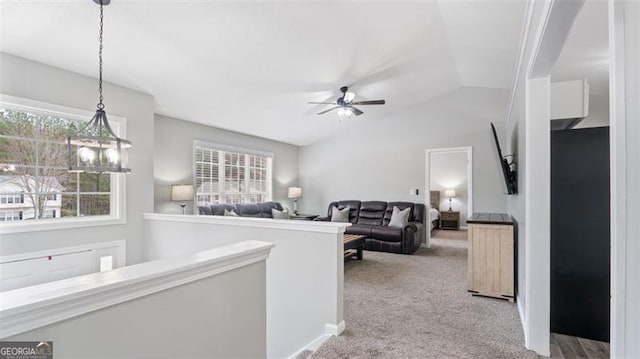 hall with lofted ceiling and carpet floors