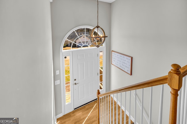 foyer entrance with plenty of natural light and light wood-style floors