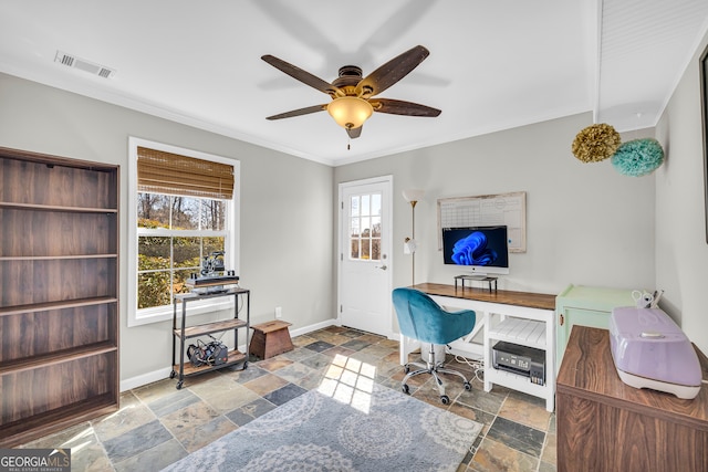 office featuring visible vents, a ceiling fan, stone tile floors, crown molding, and baseboards