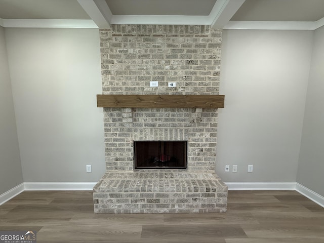 73 Hewett Rd, Pendergrass, GA 30567 - detailed view of wood finished floors, baseboards, and a fireplace